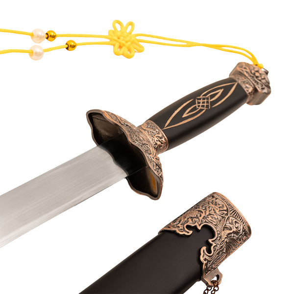 The SMAI Tai Chi Sword Jian Carbon Steel features a black handle with gold patterns, ornate bronze guard and pommel, straight silver blade, and a black sheath with bronze detailing and yellow tassel.