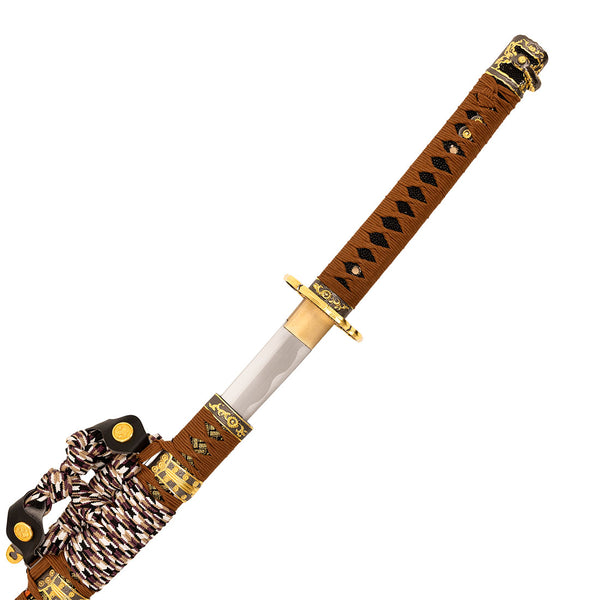 The SMAI Forged Carbon Orange Katana - Sun Emperor features a partially exposed folded steel blade, brown and black wrapped handle, gold accents, and decorative cord with ornate fittings.