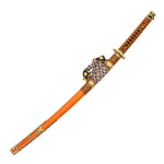 The Forged Carbon Orange Katana - Sun Emperor by SMAI features an orange and brown scabbard with gold details, a cord-wrapped hilt, and a handle adorned with a black-accent diamond pattern.