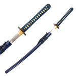 The SMAI Katana - Blue Ivy Dragon features a blue handle with gold diamond patterns and a matching sheath. One clay-tempered katana is fully sheathed, while the other is partially unsheathed to display its blade.