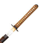 A close-up of the SMAI Forged Katana - Black Copper Dragon’s full tang handle, wrapped in brown cord with gold accents, and a partially drawn blade featuring a simple curved marking near the base.