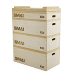 A stack of four SMAI Jerk Blocks 2.0 (Pair), labeled 15cm, 30cm, 30cm, and 38cm, is ideal for jump training or as weightlifting blocks during strength workouts.