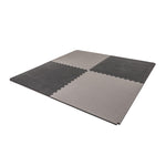 The SMAI Jigsaw Mat - 3cm - Factory Seconds features four interlocking mats with cosmetic imperfections in light and dark gray, arranged in a square. Ideal as affordable gym flooring or for various spaces.