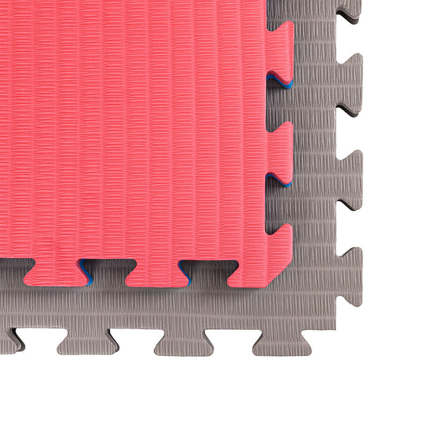 Two partially connected SMAI Jigsaw Mats (4cm, Factory Seconds with cosmetic imperfections) in red and gray display textured surfaces and puzzle-like edges against a white background.