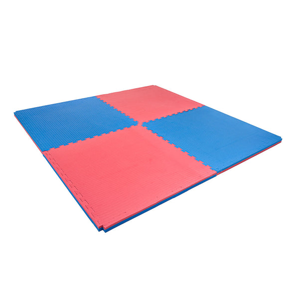 Four SMAI Jigsaw Mats (4cm, Factory Seconds) with cosmetic imperfections interlock to form a soft, red and blue square pattern on a white background.