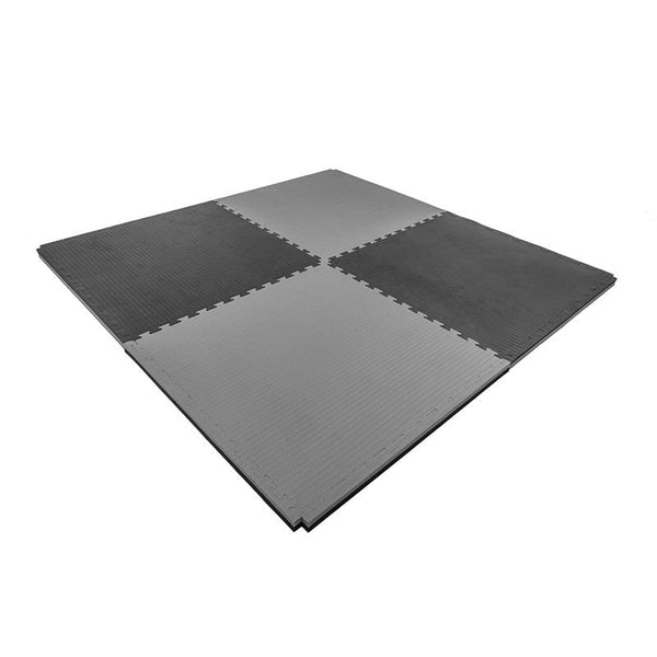 Four interlocking 4cm SMAI Jigsaw Mats—Factory Seconds with cosmetic imperfections—in dark and light gray are arranged in a square on a white background, ideal for use as gym tiles.
