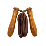 The Leather Skipping Rope - Wooden Handles by SMAI features thick wooden handles engraved with the brand logo and a durable dark brown leather rope, neatly coiled between the handles for a classic look.