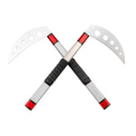 Two red-handled SMAI Kama Prism Demo sickles with silver blades and circular cutouts are crossed in an X shape against a white background, highlighting this popular martial arts demonstration weapon.
