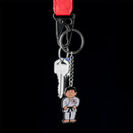 Martial arts man keyring on black background