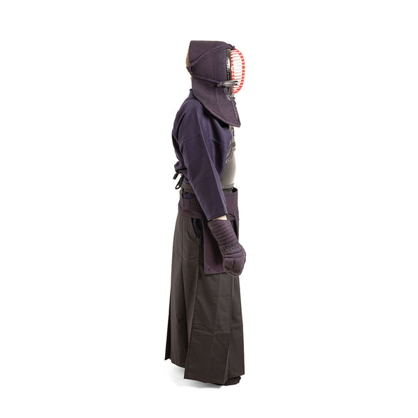 A person in profile wears the SMAI Kendo Bogu Set, including helmet, padded gloves, jacket, and pleated trousers, shown against a white background.