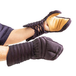Two hands wear padded, lace-up gloves with exposed wrists, dark exteriors, and tan palms from the SMAI Kendo Bogu Set—protective gear inspired by traditional Kendo armour.