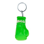 The SMAI Boxing Glove Keyring features a green mini glove with "SMAI" in white on the wrist strap, attached to a metal keyring and chain—a fun novelty boxing gift or accessory.