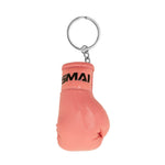 The SMAI Boxing Glove Keyring features a small pink glove with black lettering by the wrist and a metal key ring on top, making it a fun and unique boxing-themed accessory or gift.