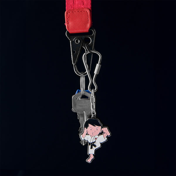 Man Kicking - Keyring on black Background