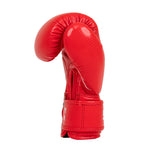 A single SMAI Essentials Kids Boxing Glove - Red, featuring a shiny leather-like finish, stands upright against a plain white background.