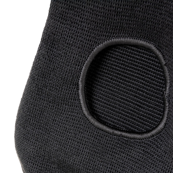 Close-up view of the SMAI Padded Knee Guard - Extra Small shows black knit fabric with a stitched, rounded rectangular padded area, designed for protective use in judo or other martial arts.