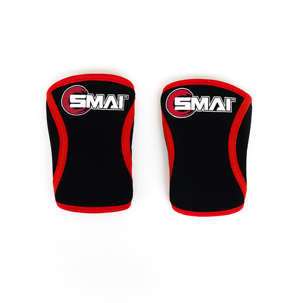 A pair of "Knee Sleeve (Pair) - Small" with black neoprene and red edges, featuring the white and red "SMAI" logo, is displayed on a white background. Perfect for powerlifting, these stylish sleeves by No Sync To Channel Engine blend form and function seamlessly.