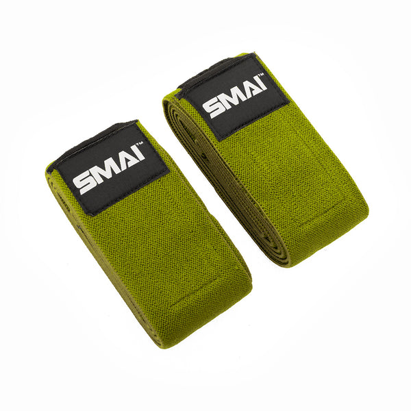 Two green fabric Knee Support Wraps - Weightlifting by SMAI, featuring black patches with the white SMAI logo, are shown side by side on a white background—ideal for powerlifting or added grip and support during squats.