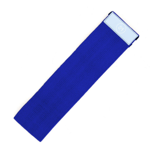 The Sweat1000 Knitted Mini Band Heavy Blue, featuring a light blue logo patch, is a rectangular polycotton resistance band lying flat against a white background. Designed for fitness exercises, it offers heavy resistance to enhance your workout. Brand: No Sync To Channel Engine.