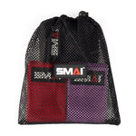 A black mesh drawstring bag, showcasing a sleek black-and-white logo with a distinctive red triangle on the letter "A", contains vibrant red and purple knitted mini resistance bands. This set of three is perfect for glute activation exercises.