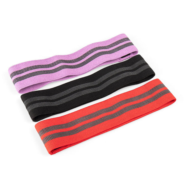 Laid out side by side are three Knitted Mini Resistance Bands from No Sync To Channel Engine, with each band in purple, black, and red. These bands feature two parallel black stripes along their length and are perfect for glute activation due to their flat and textured design. The set also includes a convenient carry pouch.