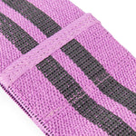 Close-up of a No Sync To Channel Engine Knitted Mini Resistance Band from the set of 3, featuring two parallel black stripes. The woven texture and folded section, secured with precise stitching, form a thick, ribbed pattern perfect for glute activation exercises.
