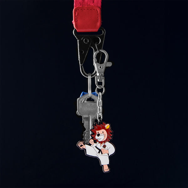 Karate lion keyring on black background