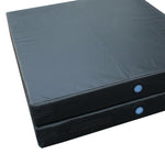 This is a pair of black SMAI Gymnastics Landing Crash Mats in a stack, featuring smooth surfaces and blue circular patches on the sides. These thick, foldable, rectangular mats are designed for safety during gymnastic exercises or physical activities.