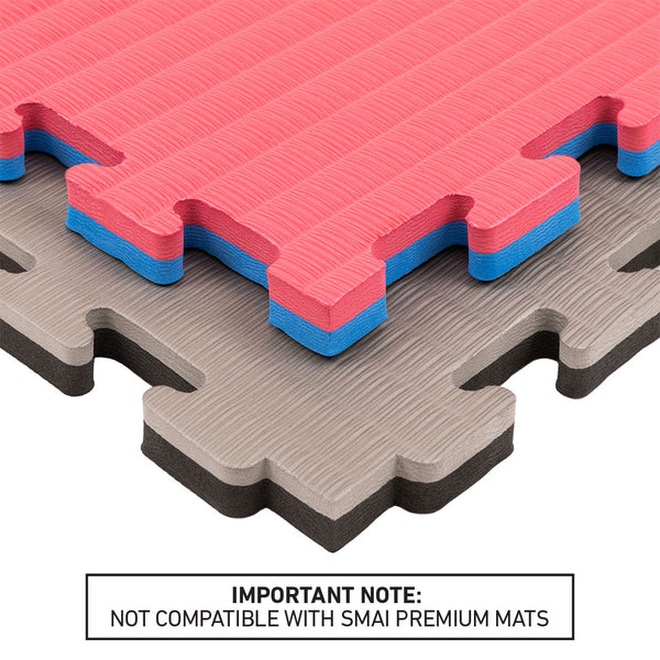 Stacked SMAI Jigsaw EVA Mats (Value Range, 2cm) in red, blue, gray, and brown display textured surfaces and interlocking connector edges—ideal for use as gym flooring or jigsaw mats. A note below reads: “Not compatible with SMAI Premium Mats.”.