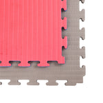 The SMAI Jigsaw EVA Mat - Value Range - 2cm features two interlocking foam mats, gray and pink, with textured surfaces and jigsaw edges—perfect for gym flooring or play areas.