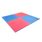 The SMAI Jigsaw EVA Mat - Value Range - 2cm features interlocking, textured tiles in red and blue that form a large checkerboard square, ideal for gym flooring or play areas.