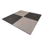 The SMAI Jigsaw EVA Mat - Value Range - 2cm features four interlocking foam mats in light and dark gray, forming a stylish square design—ideal for gym flooring or versatile jigsaw mat use.