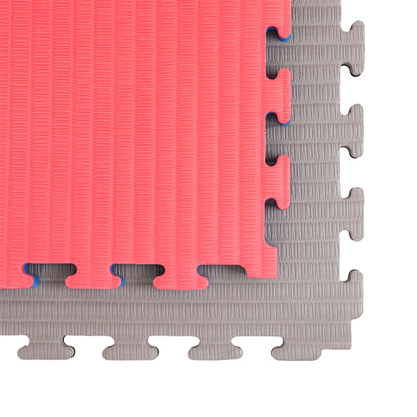 Two interlocking SMAI Jigsaw EVA Mat - Value Range - 3cm mats, one red and one gray, are shown on a white background. Their textured surfaces and puzzle edges make them ideal for martial arts flooring.