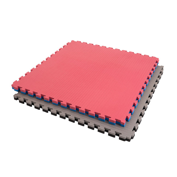 The SMAI Jigsaw EVA Mat - Value Range - 4cm features three interlocking foam mats in red, blue, and gray with puzzle edges, stacked neatly—perfect jigsaw mats for gym flooring.