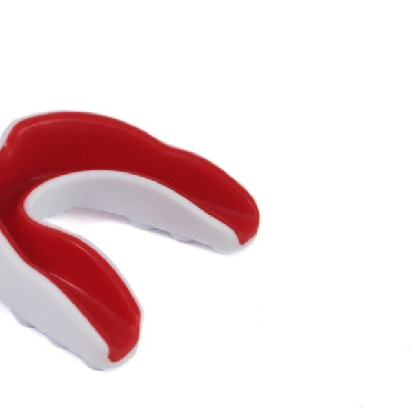 A junior Mouth Guard in red and white, branded by SMAI, showcases its gel-fit liner for optimal protection against a plain white background, ready to safeguard teeth during rigorous sports activities.