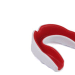 A red and white SMAI Mouth Guard - Junior Gel, designed with a gel-fit liner for maximum protection, is displayed on a white background, highlighting the upper dental mold.