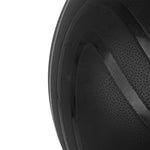 Close-up of the SMAI The Yard - Slam Ball 50kg, showing its textured, durable rubber surface and curved lines, with part of the sand-filled ball visible against a white background.