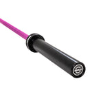 Close-up of the SMAI Barbell - Magenta Ceramic Coat - 15kg, showing its black sleeve and magenta bar. The ceramic-coated sleeve's end cap displays the SMAI logo and text.