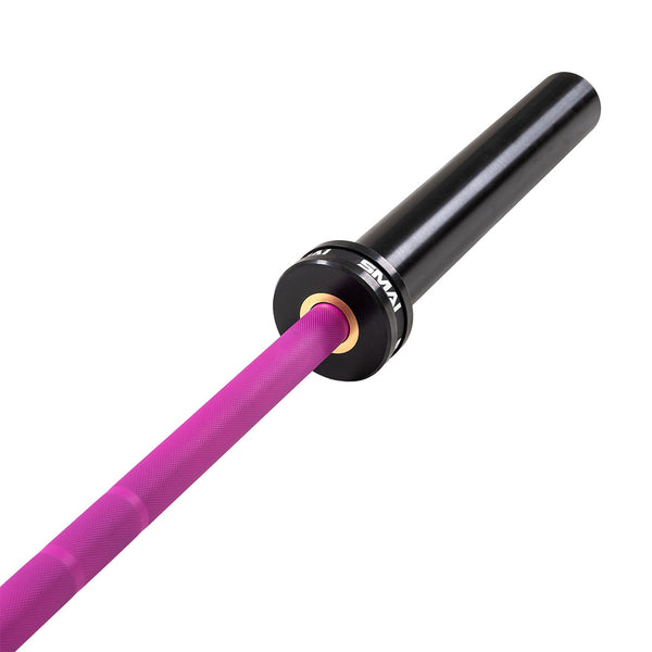 A close-up of the SMAI Barbell - Magenta Ceramic Coat - 15kg shows its bright pink shaft and black sleeve, with knurling and branding detail visible on the end, isolated on a white background.