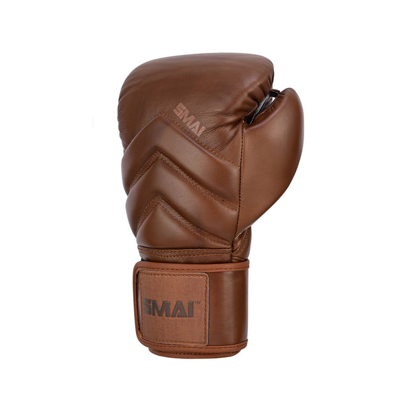 The SMAI Memory Tec Leather Boxing Glove in antique brown features visible stitching, a Velcro wrist strap with the "SMAI" logo, and is shown against a plain white background.