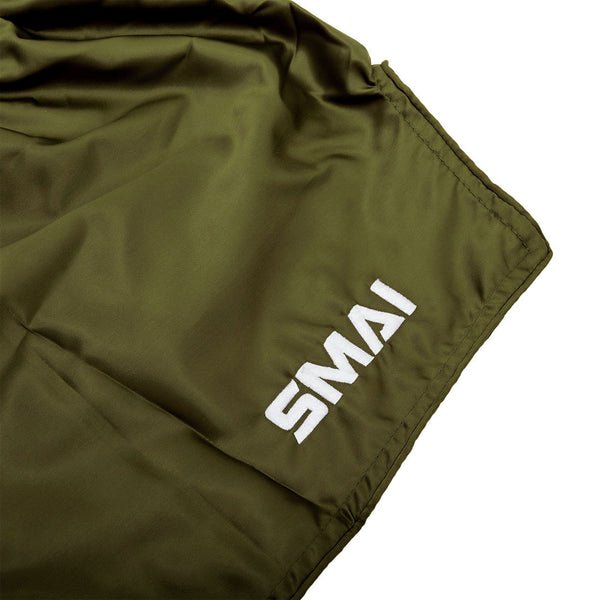 Olive green, quick-dry SMAI Muay Thai Shorts - Olive Green featuring the brand name printed in white on the lower corner.