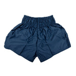 SMAI Muay Thai Shorts - Navy, crafted from satin polyester with a wide gathered elastic waistband and loose-fit legs, displayed flat on a white background.