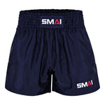 The SMAI Muay Thai Shorts - Navy feature a wide elastic waistband and display the “SMAI” logo in white and red on both the waistband and lower left leg. These unisex shorts are crafted for optimal comfort and performance.