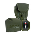 The SMAI Elite85 Boxing Glove in olive green features visible stitching and a black and white SMAI logo on the wrist strap. Designed to reduce injury, one glove stands upright while the other lies on its side.