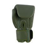 The SMAI Elite85 Boxing Glove in Olive Green features injection moulded padding, white stitching, a Velcro strap, and is presented upright against a white background.