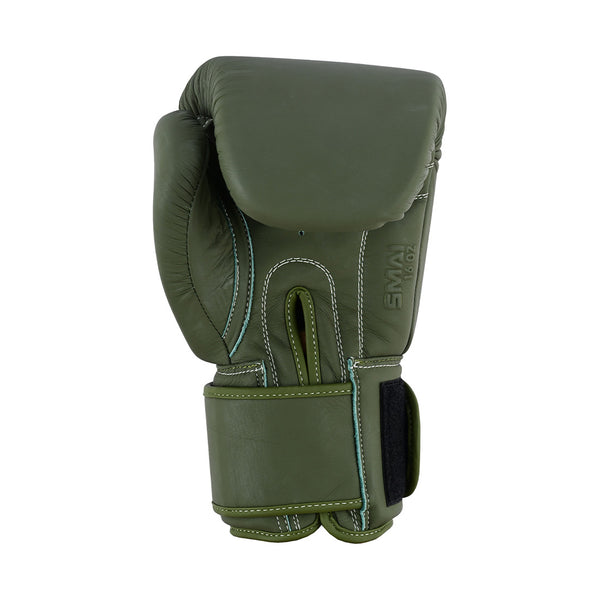 The SMAI Elite85 Boxing Glove in Olive Green features injection moulded padding, white stitching, a Velcro strap, and is presented upright against a white background.