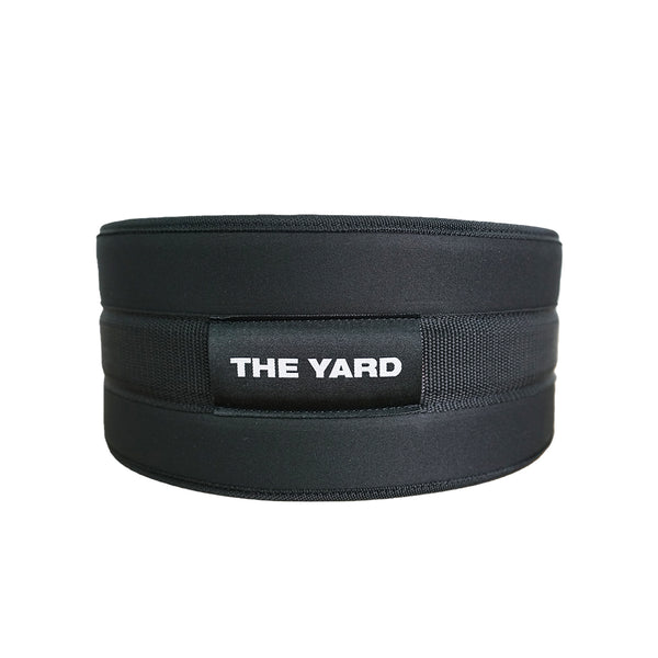 The SMAI The Yard - Nylon Weightlifting Belt - Large is a black adjustable belt with "THE YARD" in white on a front patch, designed for lower back support and shown on a plain white background.