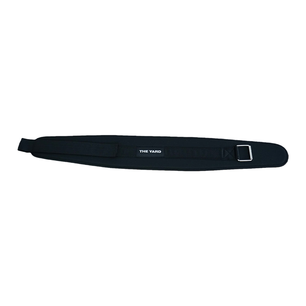 The SMAI The Yard - Nylon Weightlifting Belt (Large) is a black padded adjustable belt with “THE YARD” in white at the center, offering strong lower back support and a sturdy metal buckle for weightlifting.