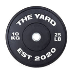 The SMAI The Yard - HD Bumper Plates (Pair) - 10kg are black, marked with "THE YARD" and "EST 2020" in white. Made from high-density virgin rubber, each plate shows "10 KG" left and "25 LB" right—perfect for any home gym.