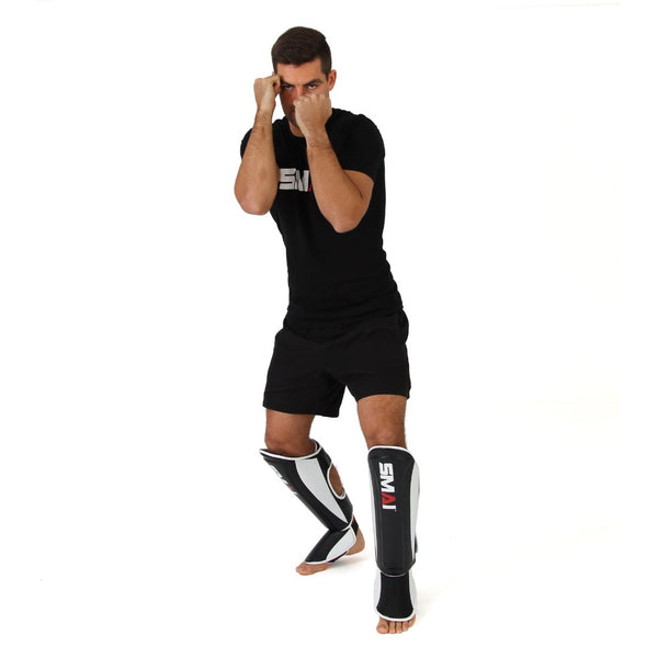 SMAI Essentials Muay Thai Shin Guards (pair) front view on foot